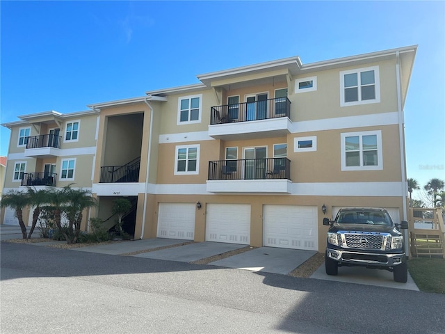 exterior space featuring a balcony and a garage