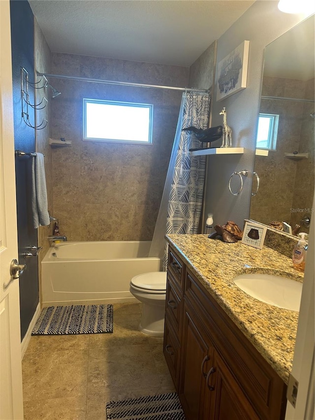 full bathroom featuring vanity, tile patterned flooring, toilet, and shower / tub combo with curtain