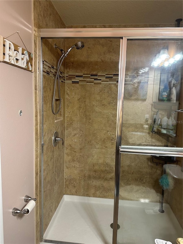 bathroom featuring an enclosed shower