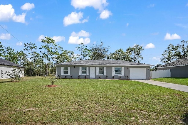 ranch-style house featuring a garage and a front lawn