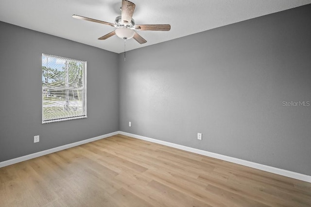 unfurnished room featuring ceiling fan and light wood-type flooring