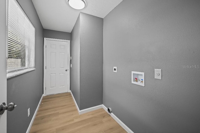 laundry area with washer hookup, hardwood / wood-style flooring, and electric dryer hookup