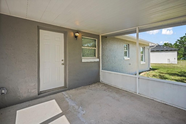 property entrance with a patio