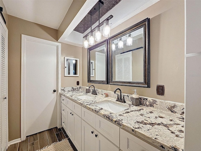 bathroom with vanity and hardwood / wood-style flooring