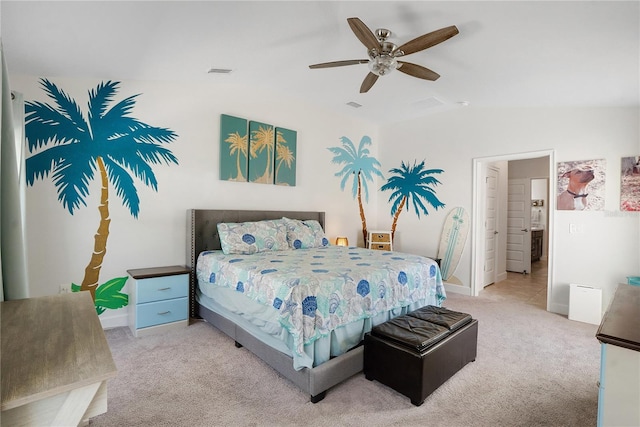 bedroom featuring ceiling fan, vaulted ceiling, and carpet flooring