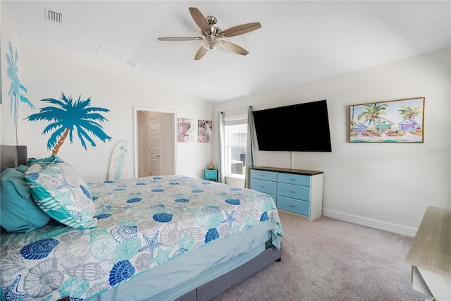 carpeted bedroom featuring ceiling fan and vaulted ceiling