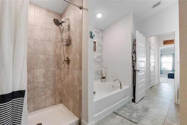 bathroom featuring vaulted ceiling, separate shower and tub, and tile patterned flooring