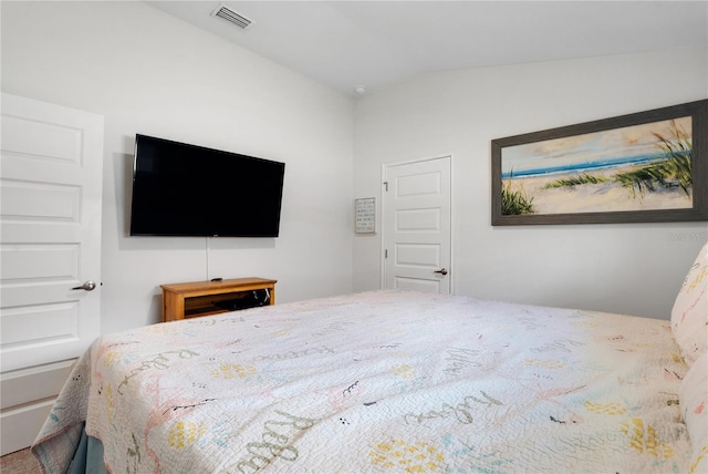 bedroom featuring vaulted ceiling