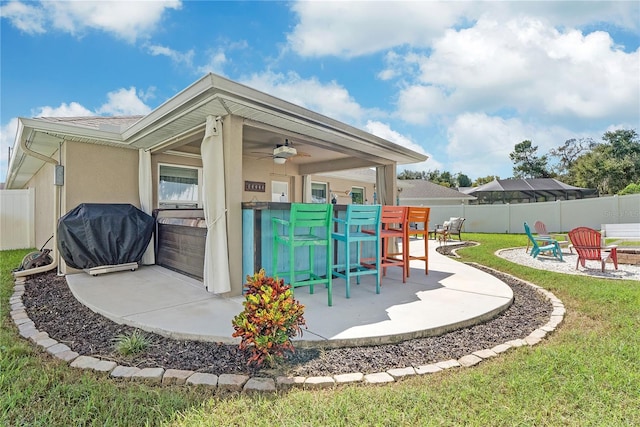 view of patio featuring ceiling fan and grilling area