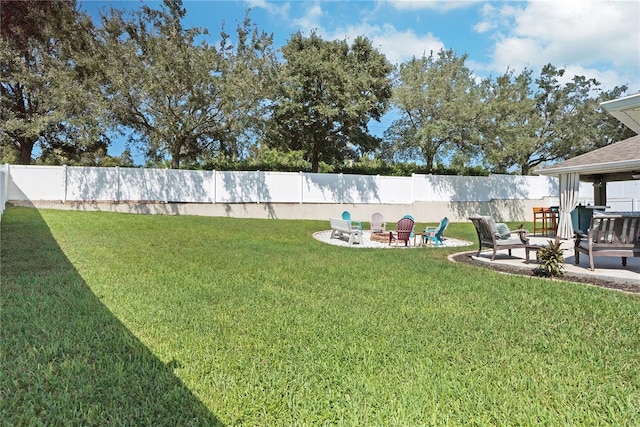 view of yard featuring a patio and an outdoor fire pit