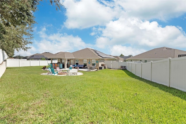 view of yard featuring an outdoor fire pit and a patio