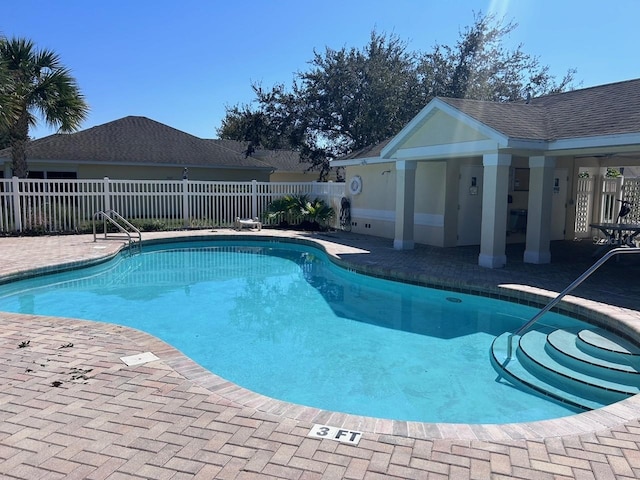 view of swimming pool with a patio area