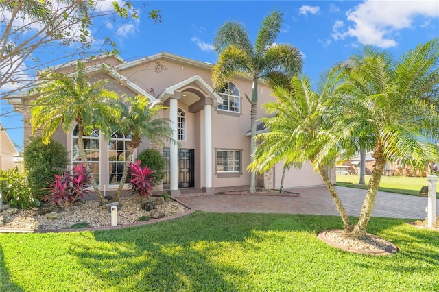 mediterranean / spanish-style home featuring a front yard