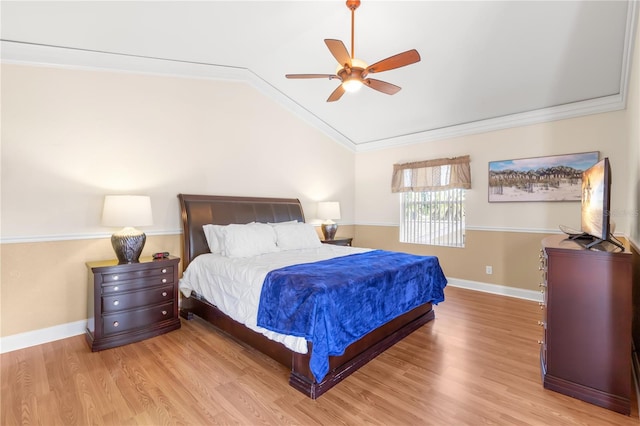 bedroom featuring ornamental molding, light wood-type flooring, ceiling fan, and lofted ceiling