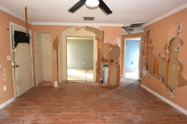 interior space featuring wood-type flooring, crown molding, and ceiling fan