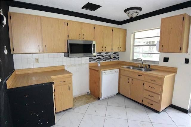 kitchen with dishwasher, light tile patterned floors, sink, and tasteful backsplash