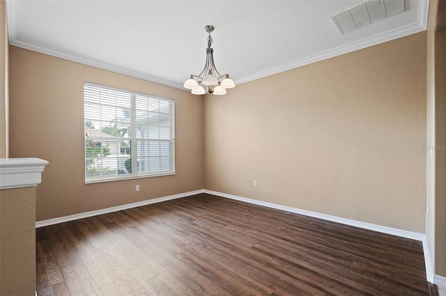 unfurnished room featuring an inviting chandelier, crown molding, and dark hardwood / wood-style flooring