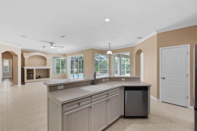 kitchen with pendant lighting, an island with sink, sink, and stainless steel dishwasher