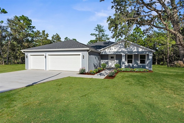 view of front of property with a garage and a front yard