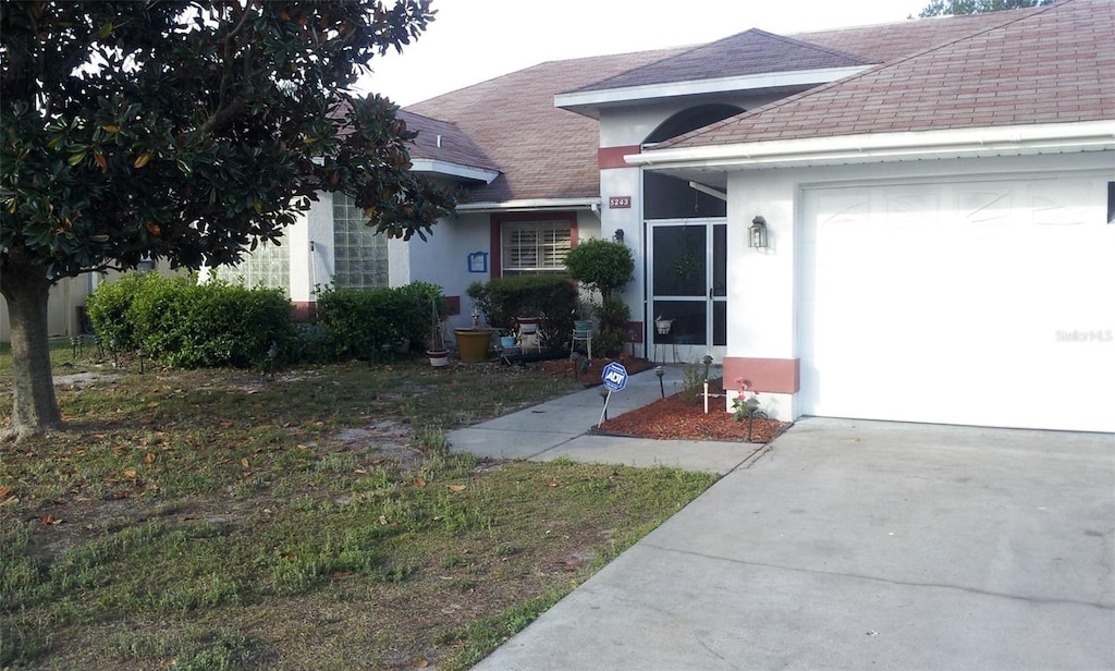 view of front of home with a garage