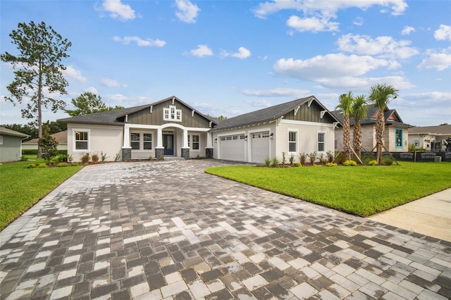 craftsman inspired home featuring a front lawn and a garage