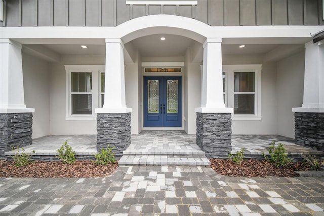 property entrance with french doors and a porch