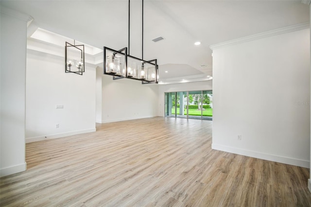 interior space with light hardwood / wood-style flooring and crown molding