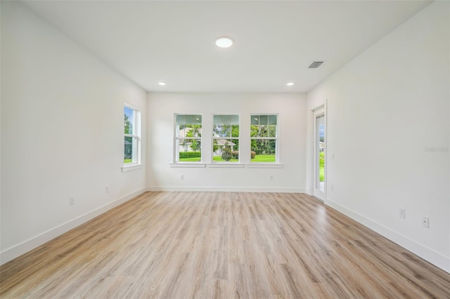 unfurnished room featuring light hardwood / wood-style flooring