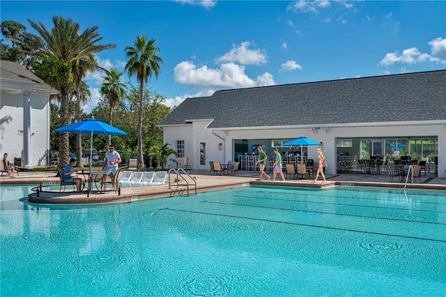 view of pool featuring a patio