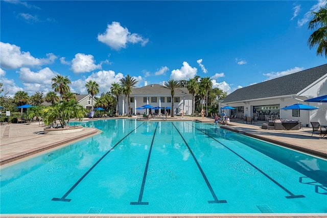 community pool with a patio area