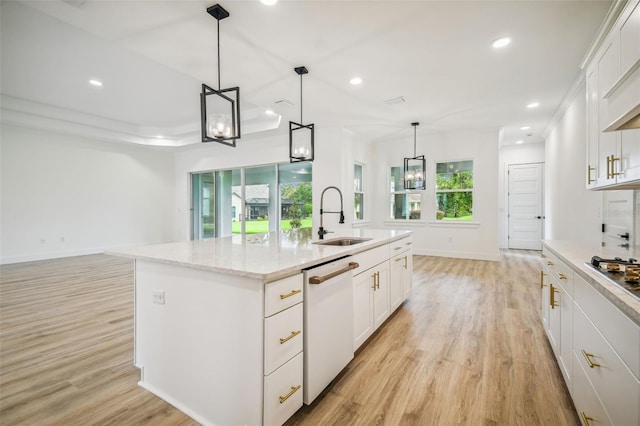 kitchen featuring pendant lighting, a center island with sink, white cabinets, a sink, and dishwasher