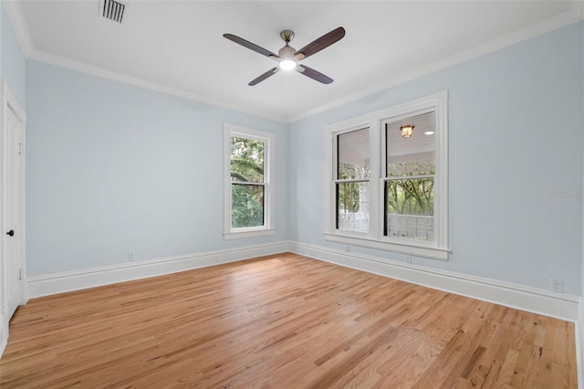 spare room featuring ceiling fan, light hardwood / wood-style flooring, and ornamental molding