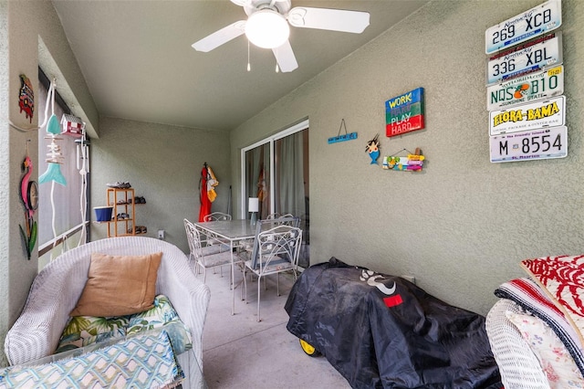 sunroom featuring ceiling fan