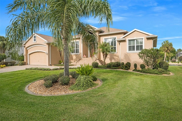 view of front of house with a front yard and a garage