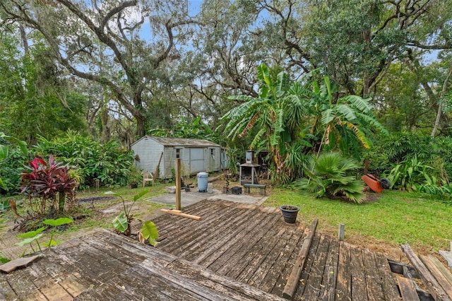 wooden terrace with a shed