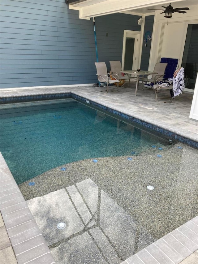 view of pool featuring a patio and ceiling fan