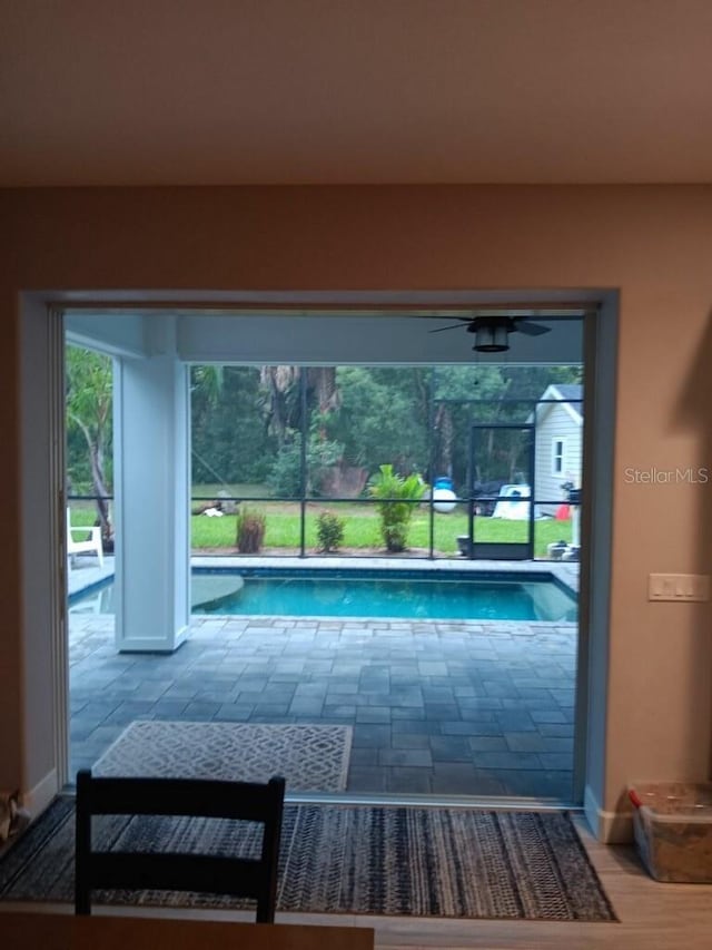 view of pool with ceiling fan