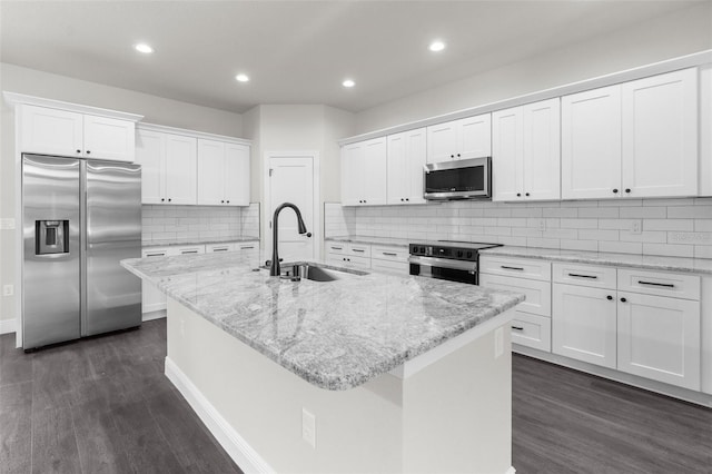 kitchen featuring sink, a center island with sink, white cabinets, and appliances with stainless steel finishes