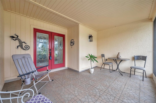 doorway to property featuring a patio and french doors