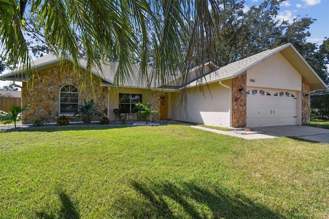 single story home with a front lawn and a garage