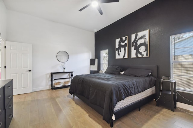 bedroom featuring light wood-type flooring and ceiling fan