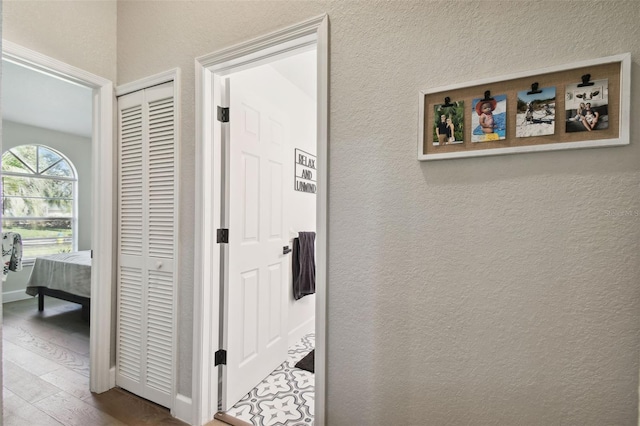 hallway with wood-type flooring