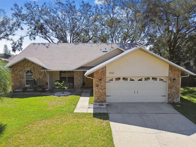 single story home with a front lawn and a garage