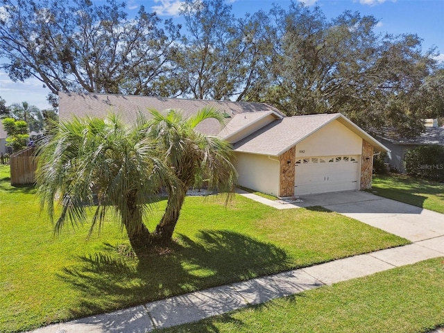 single story home featuring a garage and a front lawn