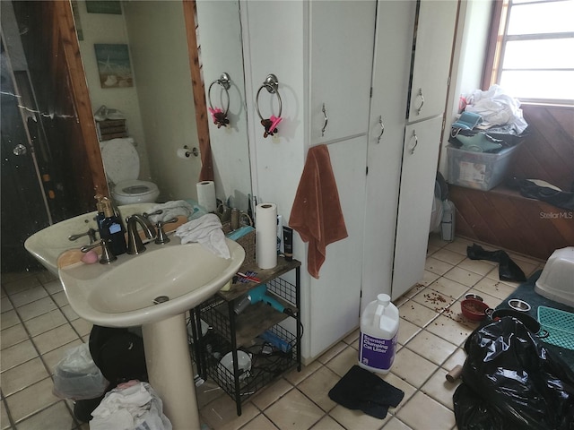 bathroom with tile patterned floors, sink, and toilet