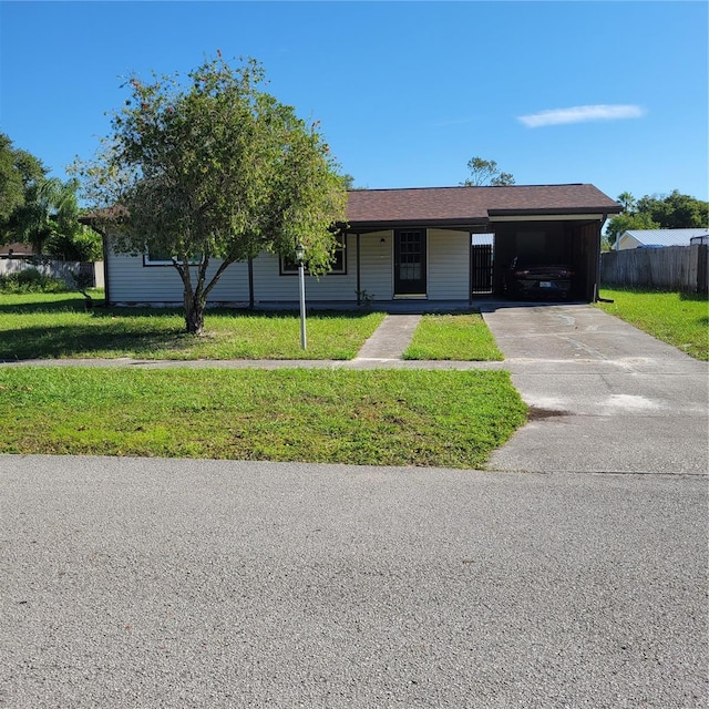 ranch-style home with a front lawn and a carport