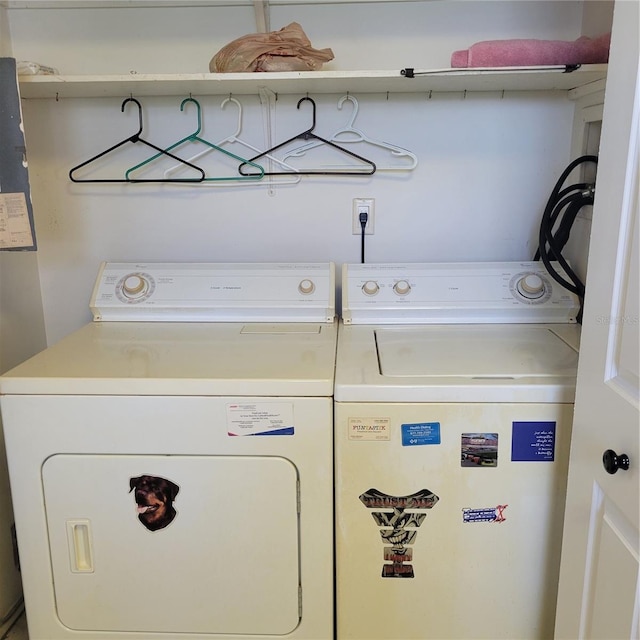 clothes washing area featuring washing machine and clothes dryer