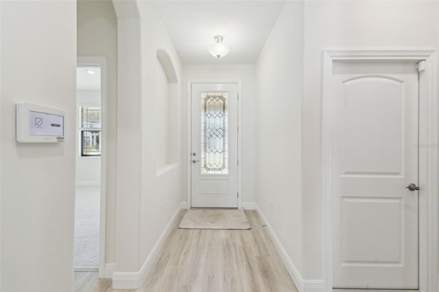 doorway to outside with light wood-type flooring