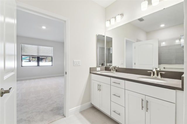 bathroom with vanity and tile patterned flooring