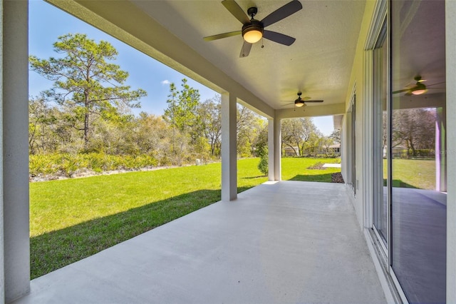 view of patio featuring ceiling fan